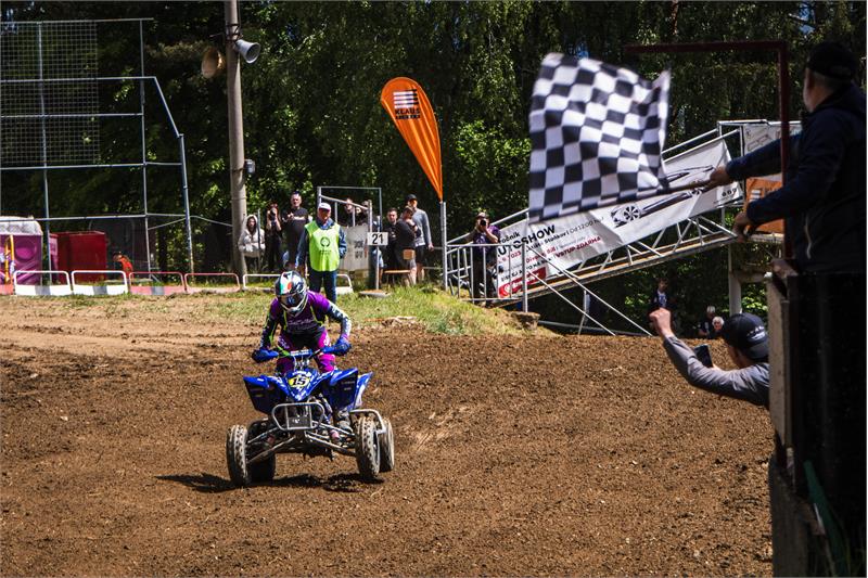 EMX R1 Turrini takes flag